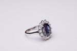Oval Sapphire with Diamond halo ring.