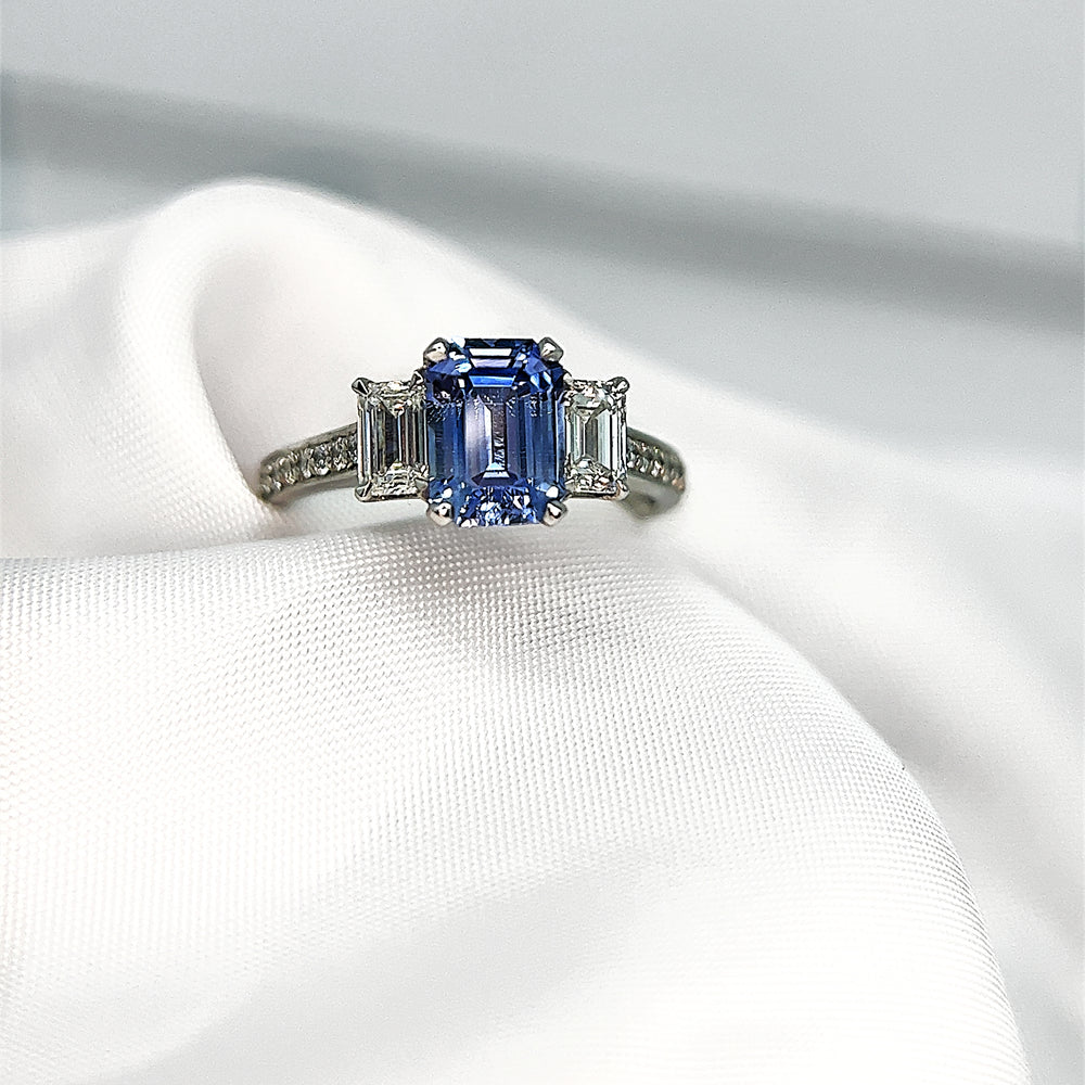 
            
                Load image into Gallery viewer, Emerald Cut Sapphire and Diamond Three Stone
            
        