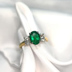 Oval Emerald and Diamond Three Stone Ring