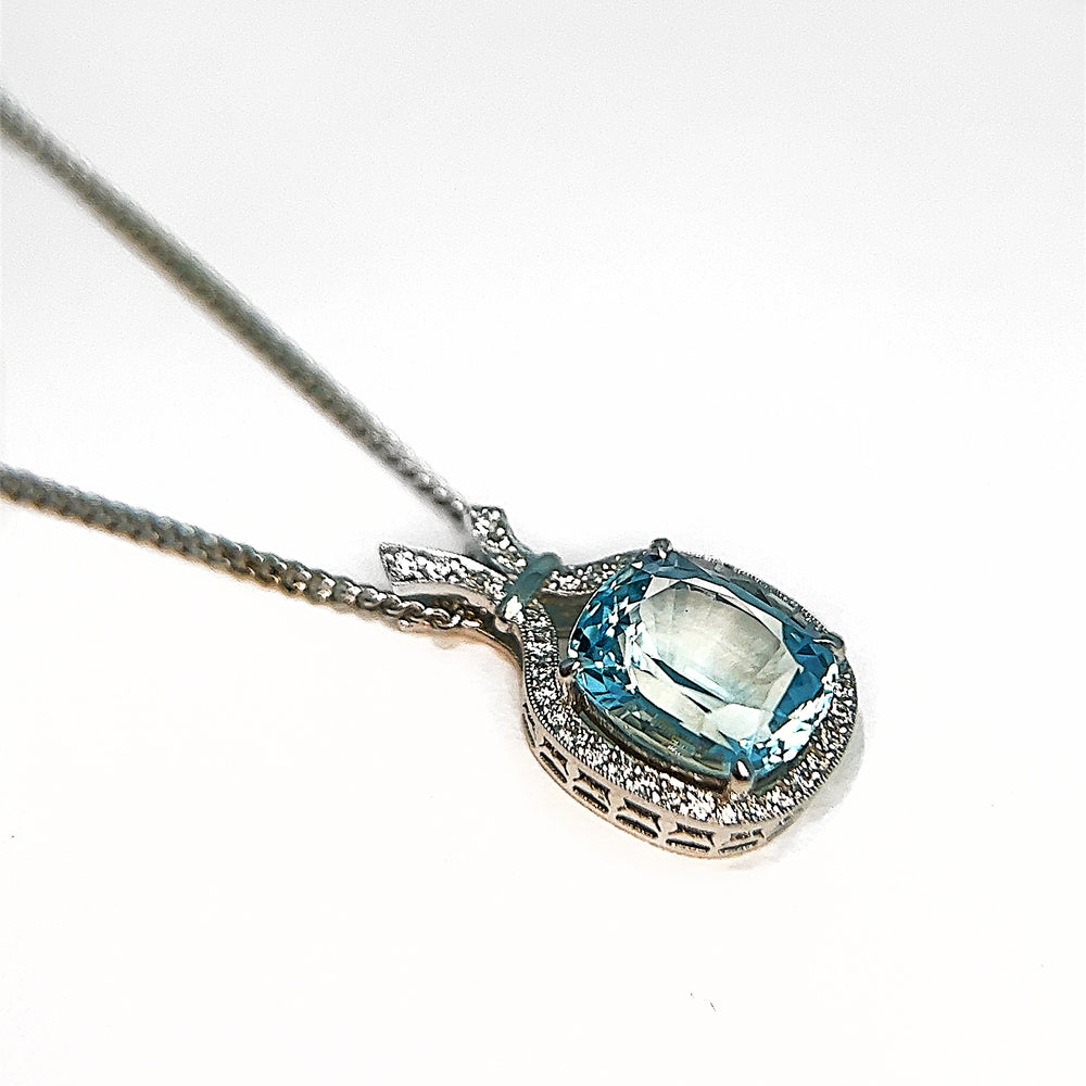 Aquamarine and Diamond Halo Pendant