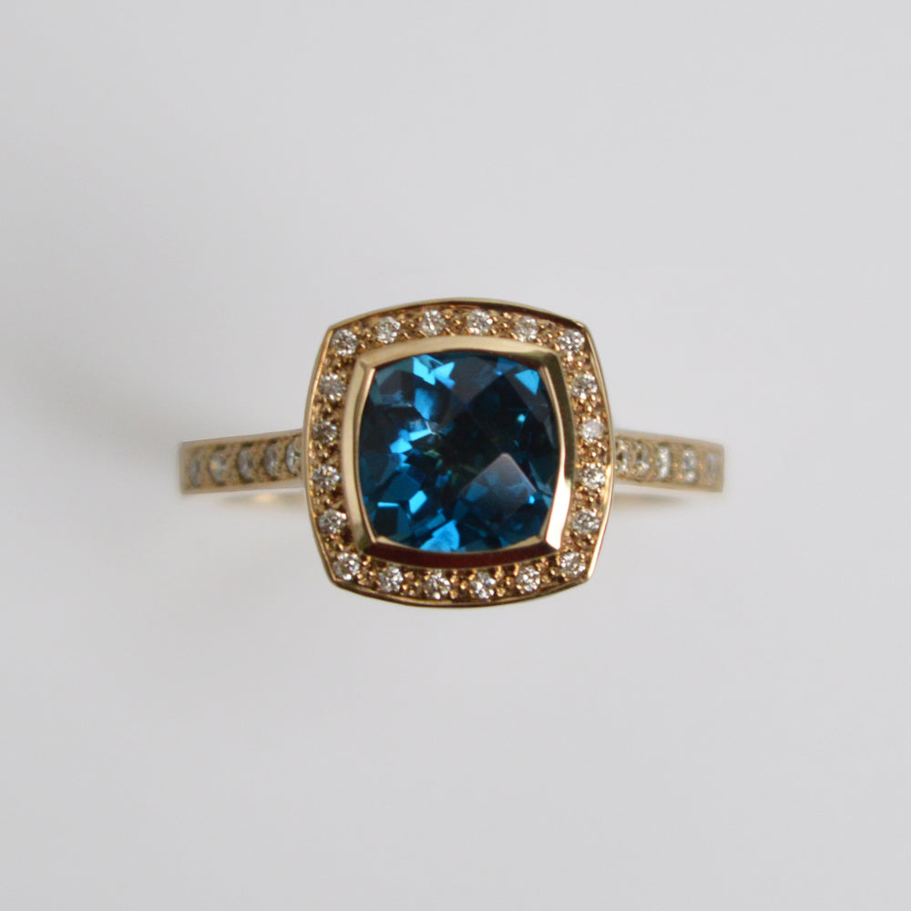 Blue Topaz & Diamond Halo Ring