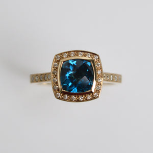 
            
                Load image into Gallery viewer, Blue Topaz &amp;amp; Diamond Halo Ring
            
        
