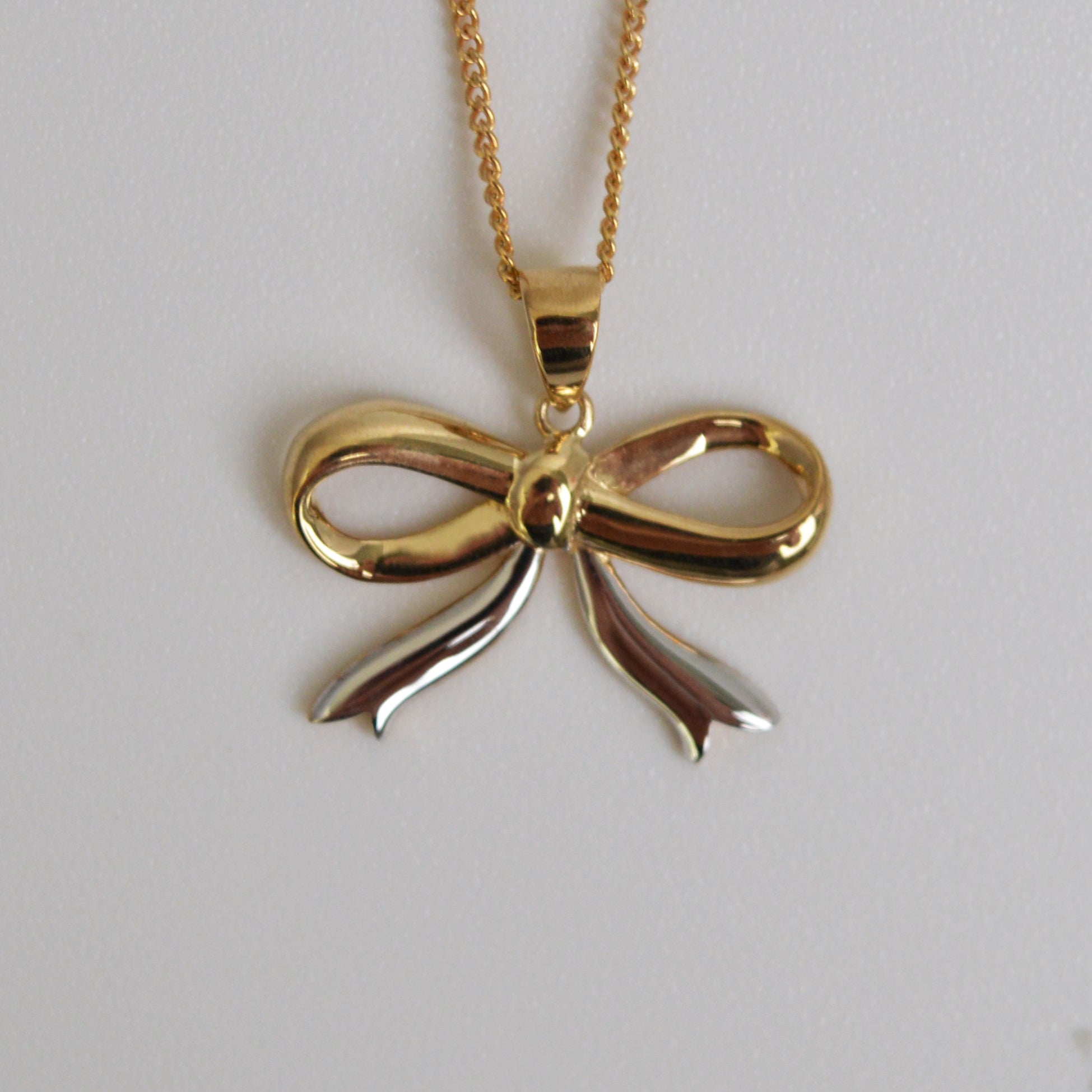 Bow pendant on sale
